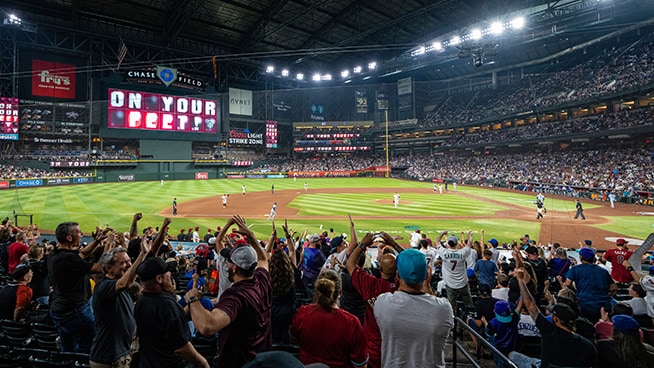 Fans celebrating the Diamondbacks in the Chase Field Stadium