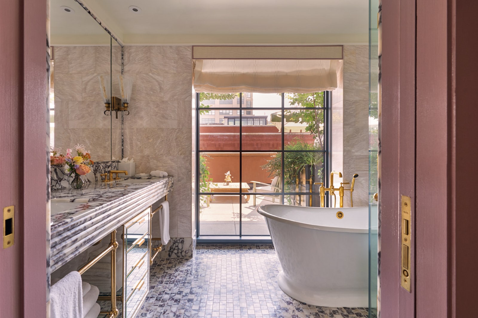 A bathroom with a prominent soaking tub and large window.