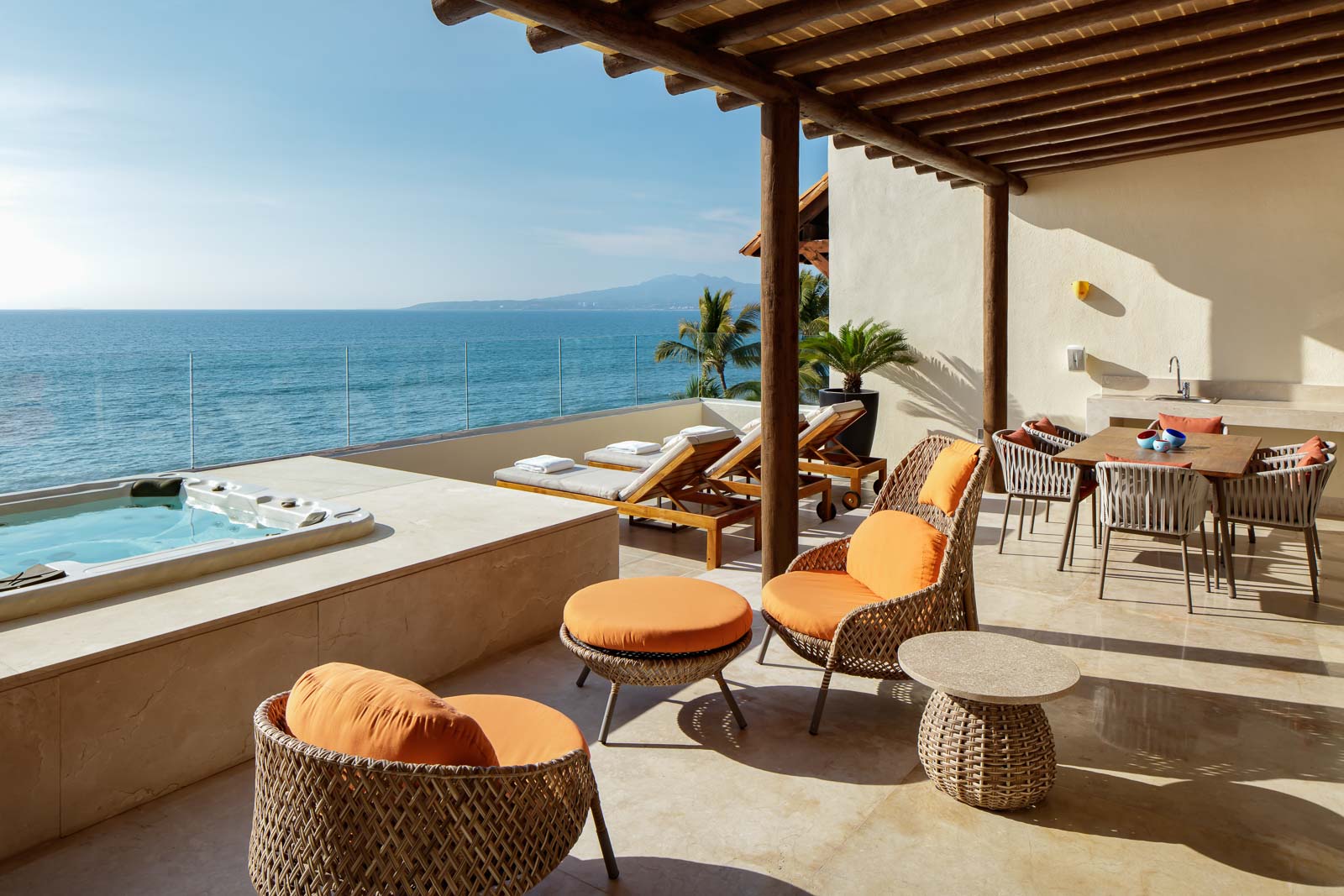 Lounge chairs on terrace with hot tub