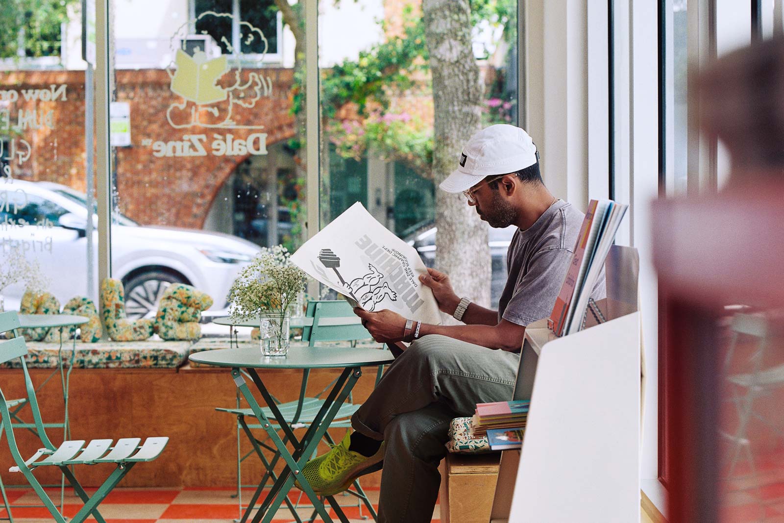 Man sitting and reading magazine