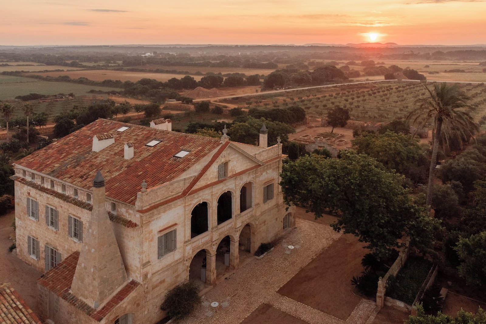 Large stone building near field